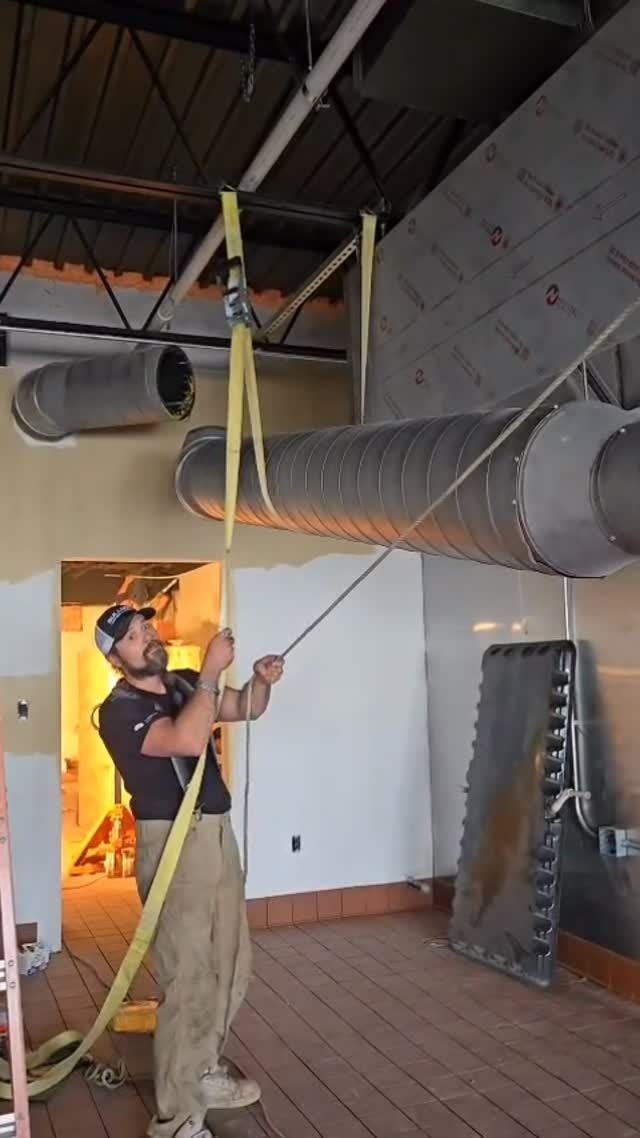 Ductwork being hung in a commercial space
