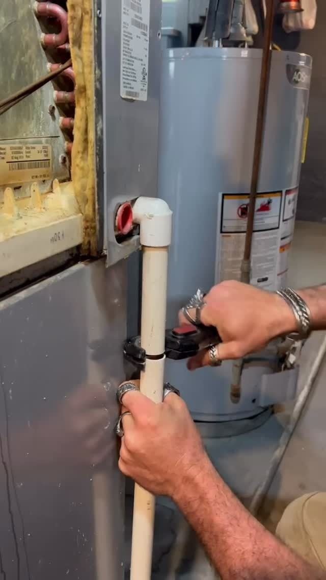 Technician servicing a water heater